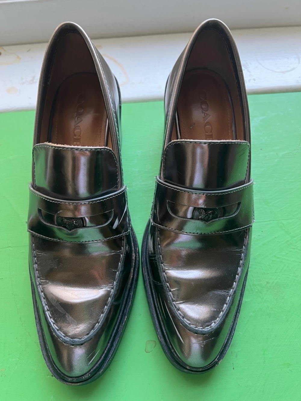 Coach women’s heeled Shiny silver Leather Penny Loafers